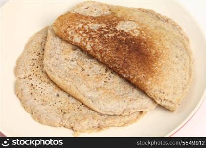 Homemade North Staffordshire oatcakes, a regional English delicacy with something approaching a cult following. These pancakes are unusual as they mix white, wholemeal and oatmeal flour and are leavened with yeast rather tham using baking powder or soda.