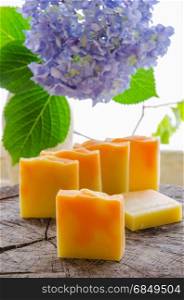 homemade orange and dandelion herbal natural soap using olive oil shea and cocoa butter