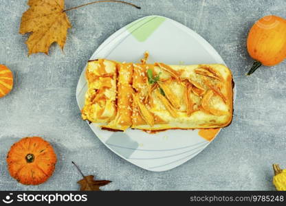 Homemade pie, autumn recipe. Cottage cheese pumpkin casserole decorated with orange peels.. Homemade cottage cheese and pumpkin casserole