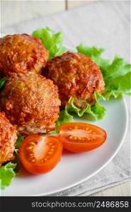 Homemade protein meat balls with vegetables in tomato sauce. Appetizing hot dish on a white plate.. Homemade protein meat balls with vegetables in tomato sauce. Appetizing hot dish on a plate.