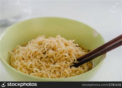 homemade quick ramen noodles with chopsticks , asian pasta