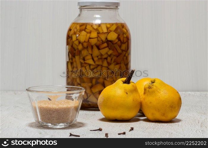 Homemade quince liqueur. Maceration of quinces in water, cane sugar, cinnamon, cloves and alcohol.