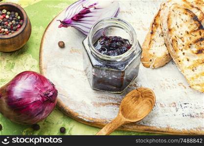 Homemade red onion jam.Onion confiture and bread toast. Onion jam or onion confiture