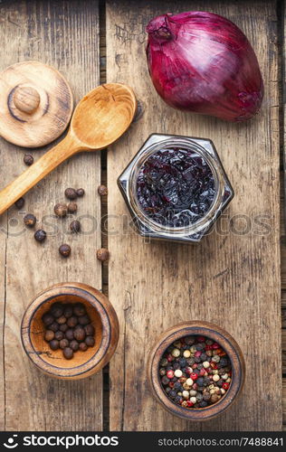 Homemade red onion jam.Onion confiture on old wooden table. Onion jam or onion confiture