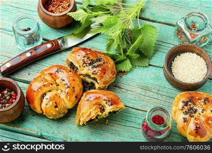 Homemade rustic nettle and spinach buns.Fresh baked buns with herbs. Appetizing bun with nettles.