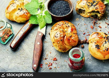 Homemade rustic nettle and spinach buns.Fresh baked buns with herbs. Homemade buns with nettles.