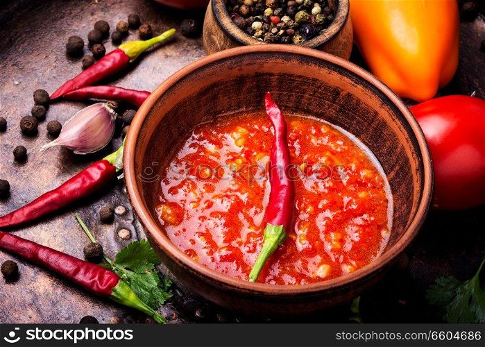 Homemade sauce adjika with pepper, garlic and tomatoes.Barbeque sauce. Spicy seasoning, adjika sauce