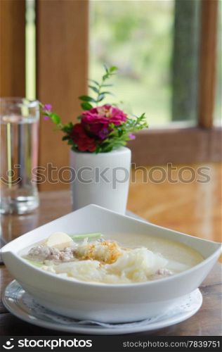 Homemade soup with , pork , meatballs , tofu and vegetable