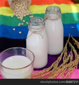 Homemade soy milk for breakfast drink, soya milk and soybean on colorful background, this beverage rich omega, protein, fibre, also delicious, nutrition, healthy drink