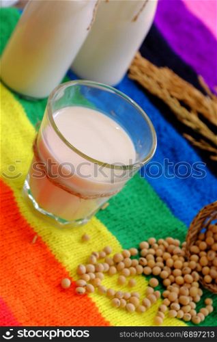 Homemade soy milk for breakfast drink, soya milk and soybean on colorful background, this beverage rich omega, protein, fibre, also delicious, nutrition, healthy drink