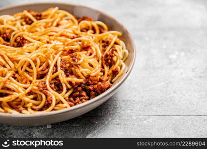 Homemade spaghetti bolognese. On a gray background. High quality photo. Homemade spaghetti bolognese. On a gray background.