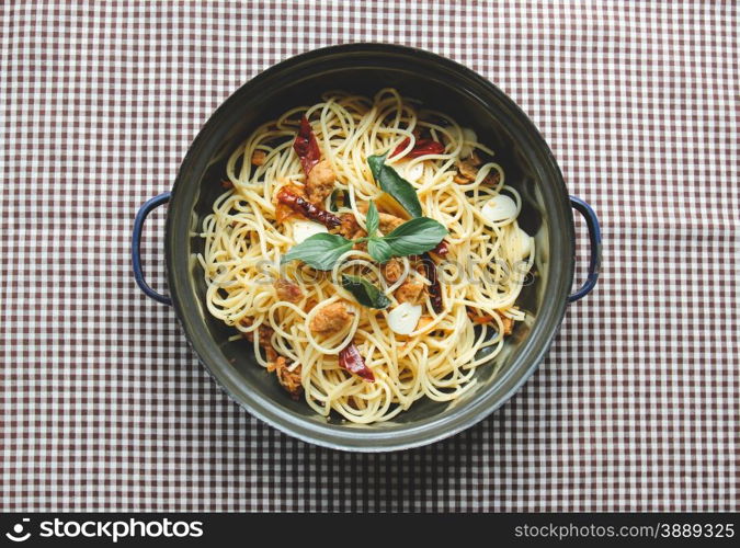 Homemade spaghetti on tablecloth