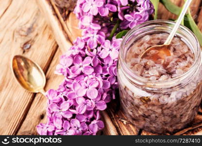 Homemade spring jam of lilac petals.Health food. Healing lilac flower jam