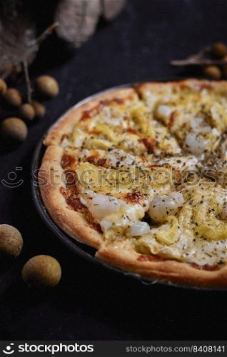 Homemade Summer Durian and longan pizza. . Durian and longan pizza.
