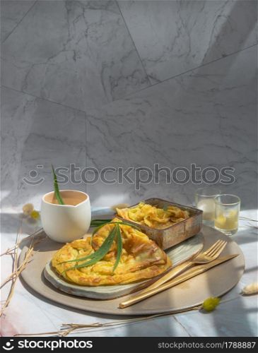 Homemade sweet frying roti (Cannabis Pancake) with Cannabis served with Cannabis tea on ceramic tray. Concept of food with cannabis herb, Treatment of medical marijuana for use in food, Copy space, Selective focus.