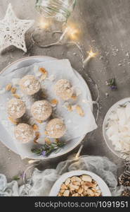 Homemade sweet white chocolate and coconut in a plate. Raffaello candy - snowball truffles on a Christmas table. Top view.