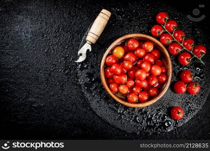 Homemade tomatoes for pickling in a plate. On a black background. High quality photo. Homemade tomatoes for pickling in a plate.