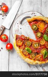 Homemade vegetarian pizza. Healthy vegetarian pizza with tomato on old wooden table
