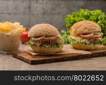 Homemade veggie burger served on wooden table.