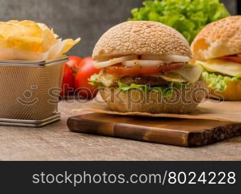 Homemade veggie burger served on wooden table.