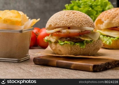 Homemade veggie burger served on wooden table.