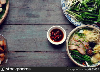 Homemade Vietnam food, egg noodle soup with wontons, colorful food ingredient for this eating as egg, pork, broth, shallot, bean sprout, agaric, vegetable