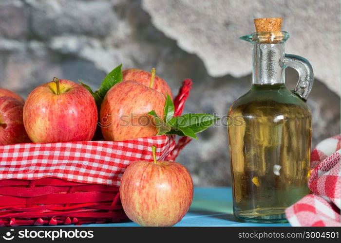 Homemade Vinegar galas apples on a table in a farmhouse