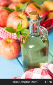 Homemade Vinegar galas apples on a table in a farmhouse