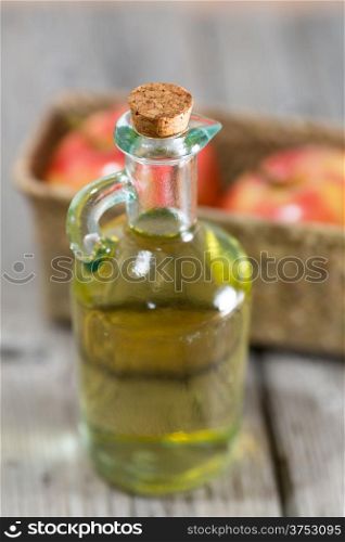 Homemade Vinegar galas apples on a table in a farmhouse