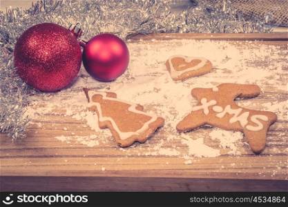 Homemade Xmas cookies with decoration on a wooden board