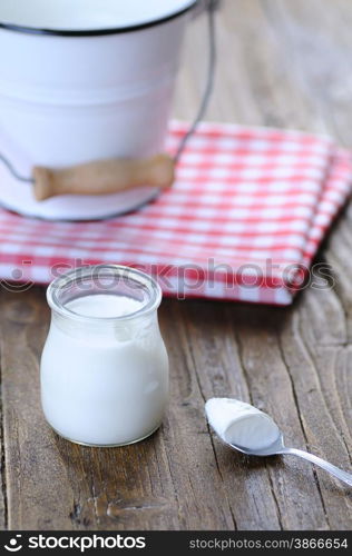 Homemade yogurt on wooden table in the kitchen&#xA;