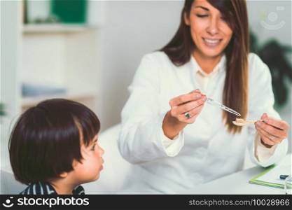 Homeopathy. Little boy and homeopath