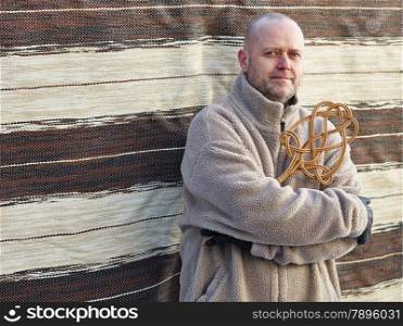 Homeworks, a man and the carpet beater