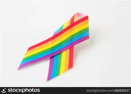 homosexual and lgbt concept - close up of gay pride awareness ribbon on white background. close up of gay pride awareness ribbon on white. close up of gay pride awareness ribbon on white