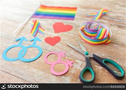 homosexual and lgbt concept - scissors and gay party props on wooden boards. scissors and gay party props on wooden boards. scissors and gay party props on wooden boards