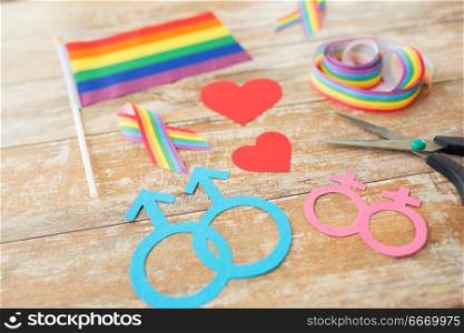 homosexual and lgbt concept - scissors and gay party props on wooden boards. scissors and gay party props on wooden boards. scissors and gay party props on wooden boards