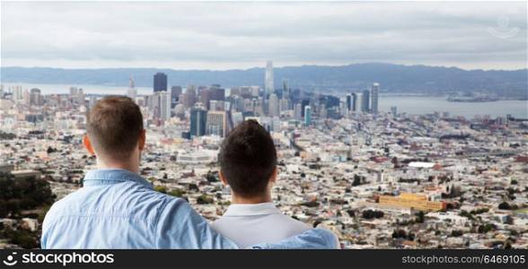 homosexual, same-sex marriage and tolerance concept - close up of happy male gay couple hugging over san francisco city view background. close up of gay couple hugging over san francisco