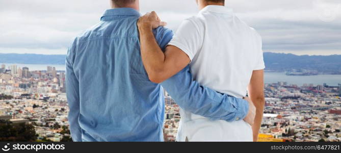 homosexual, same-sex marriage and tolerance concept - close up of happy male gay couple hugging over san francisco city view background. close up of gay couple hugging over san francisco. close up of gay couple hugging over san francisco