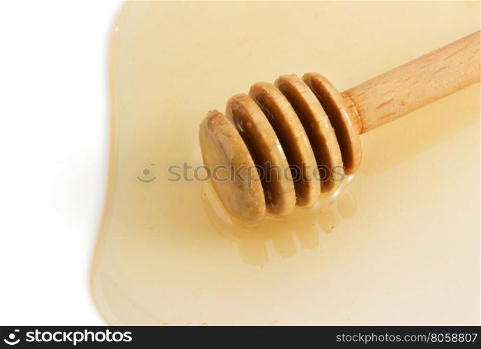 honey and stick isolated on white background