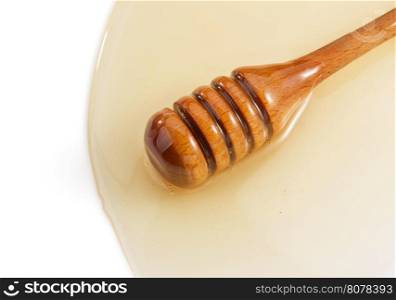 honey and stick isolated on white background