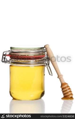 honey covered honey dipper leaning at a honey jar. honey covered honey dipper leaning at a honey jar on white background