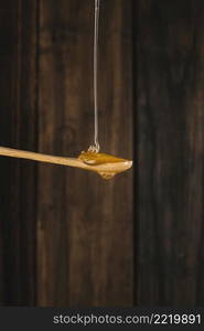 honey dripping wooden spoon