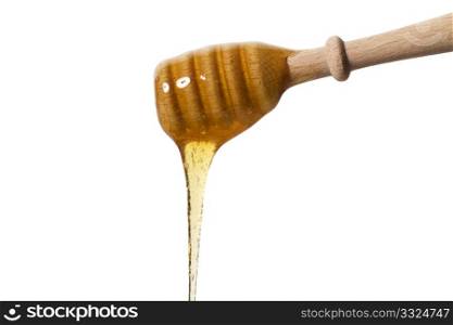 honey falling from a honey dipper. honey falling from a honey dipper on white background