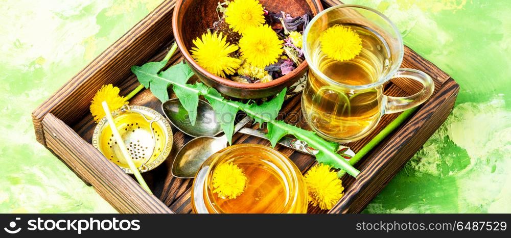 Honey from dandelion and tea. Honey from a blooming spring dandelion and cup of tea