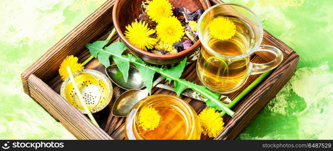 Honey from dandelion and tea. Honey from a blooming spring dandelion and cup of tea