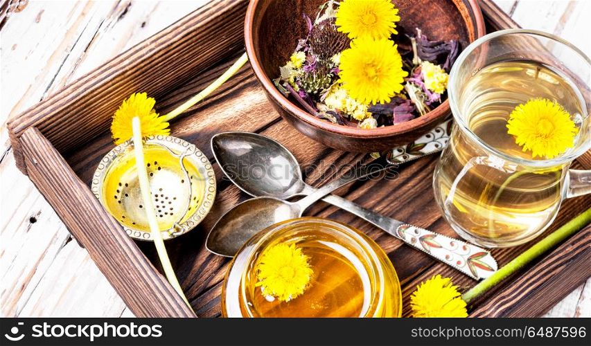 Honey from dandelion and tea. Honey from a blooming spring dandelion and cup of tea