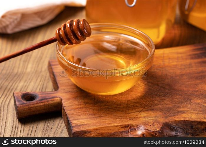 Honey isolated on on a wooden table. Honey
