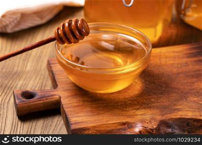 Honey isolated on on a wooden table. Honey