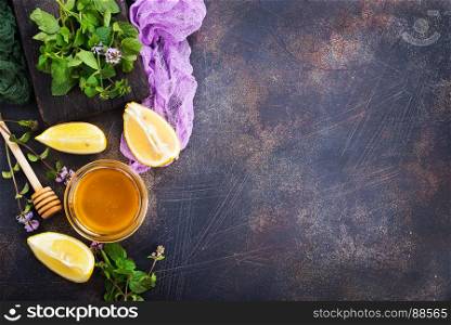 honey,lemon and fresh mint on a table