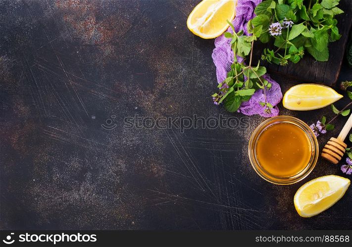 honey,lemon and fresh mint on a table